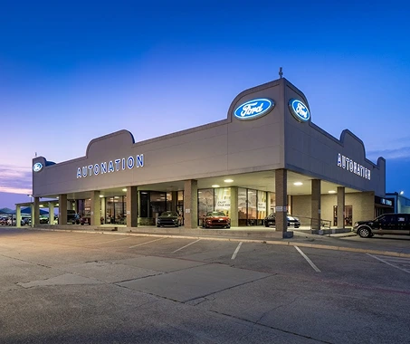AutoNation Ford South Fort Worth dealership at dusk